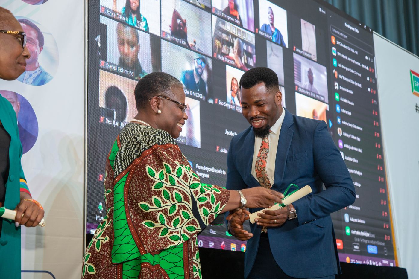 An SPPG Nigeria graduate receiving their certificate